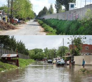 Condomínio privado cercado por muro em área mais alta ao lado de bairro alagado